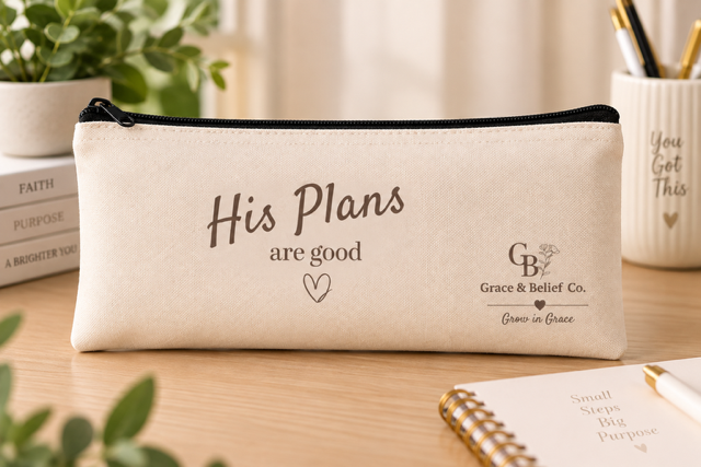 Canvas pouch printed with the words His plans are good, styled with dried flowers.